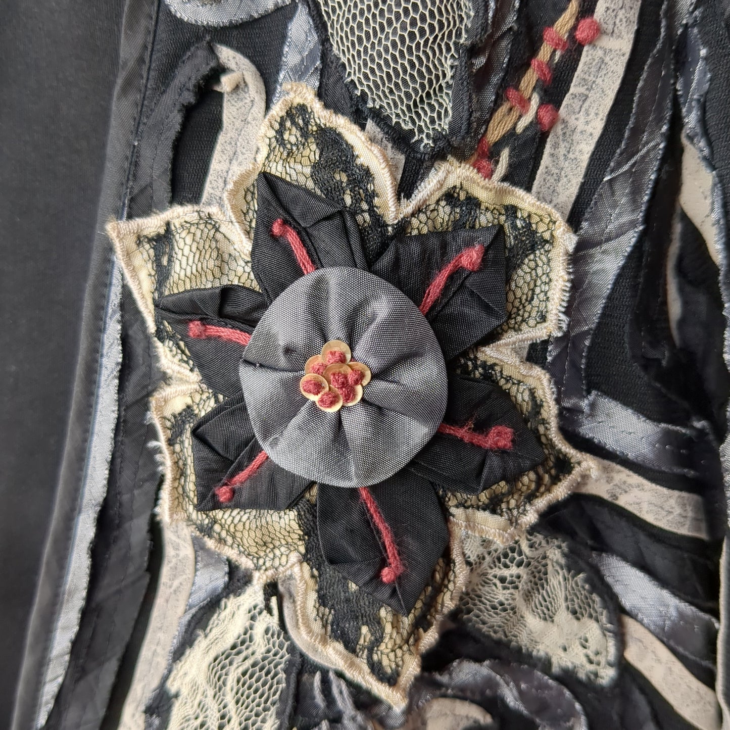 Black and gray cropped jacket with fabric flowers