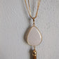 Vintage look gold tassel necklace with white stone