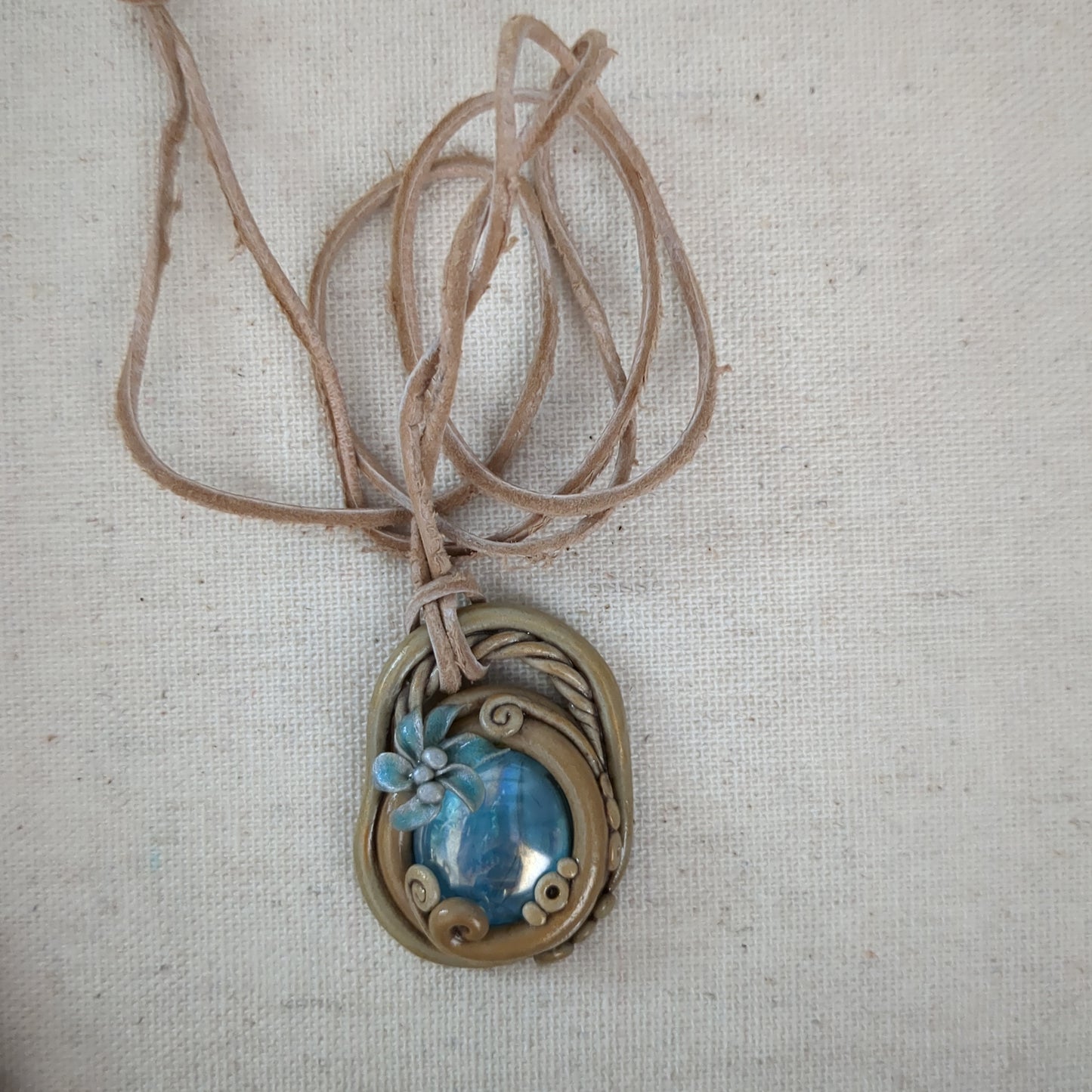 Tan and blue scrying necklace clay leather cord