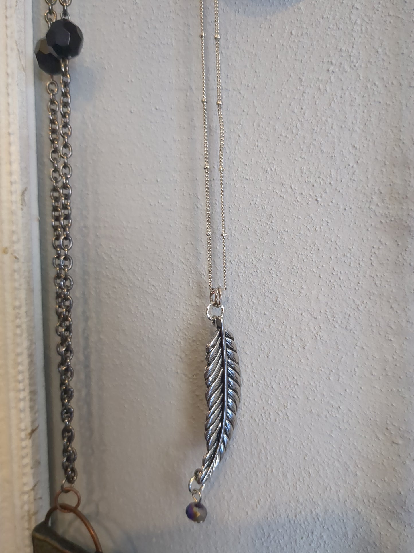 Silver feather necklace with purple bead